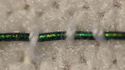 Colour-changing fibres indicate pressure in compression bandages