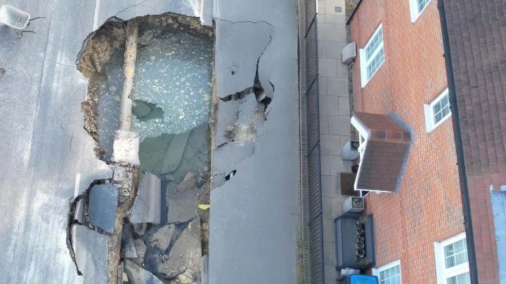 Burst water main ‘probable’ cause of Surrey sinkhole, geologists say